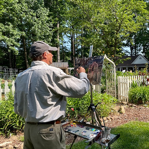 Artist painting in a public park.
